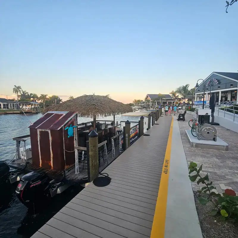 Sun setting behind the tiki boat during a Cape Coral cruise
